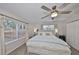 This bright main bedroom features a ceiling fan, neutral walls and an abundance of natural light at 8805 Van Fleet Rd, Riverview, FL 33578