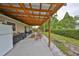 Covered patio area featuring outdoor furniture, cooking area, and an AC unit at 8805 Van Fleet Rd, Riverview, FL 33578