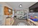 playroom featuring wall-mounted shelving and a slide, with ample natural light from multiple windows at 8805 Van Fleet Rd, Riverview, FL 33578