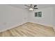 Bright bedroom with natural light, ceiling fan, and closet at 940 Woodland Dr, Palm Harbor, FL 34683