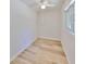 Cozy bedroom featuring natural light and wood-look floors at 940 Woodland Dr, Palm Harbor, FL 34683
