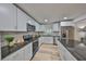 Modern kitchen with stainless steel appliances and granite countertops at 940 Woodland Dr, Palm Harbor, FL 34683