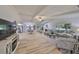 Spacious living room featuring high ceilings, modern furnishings, and an open concept layout at 940 Woodland Dr, Palm Harbor, FL 34683