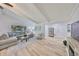 Bright, open concept living room with a comfortable sectional sofa at 940 Woodland Dr, Palm Harbor, FL 34683
