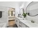 Bathroom featuring a dual vanity, quartz countertops, and view into the bedroom at 10011 Parley Dr, Tampa, FL 33626