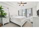 Bright bedroom with a plush bed, natural light, and neutral decor at 10011 Parley Dr, Tampa, FL 33626
