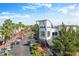Aerial view of a mixed use commercial building with ample parking surrounded by palm trees and blue skies at 10011 Parley Dr, Tampa, FL 33626