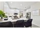 Bright kitchen features stainless steel appliances, white cabinets, and a breakfast bar with seating at 10011 Parley Dr, Tampa, FL 33626