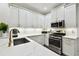 This modern kitchen boasts marble countertops, stainless steel appliances, and ample cabinet space at 10011 Parley Dr, Tampa, FL 33626