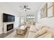 Cozy living room featuring a fireplace, ample seating, and stylish decor at 10011 Parley Dr, Tampa, FL 33626