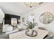 Open-concept living space with modern decor, connecting dining and living areas at 10011 Parley Dr, Tampa, FL 33626
