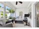 Enclosed lanai with comfortable seating, and an exercise bike for relaxation and fitness at 10011 Parley Dr, Tampa, FL 33626