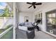 Enclosed lanai with comfortable seating, and an exercise bike for relaxation and fitness at 10011 Parley Dr, Tampa, FL 33626