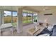 Sunroom showcasing water views, light and airy design with comfortable seating and decor at 1004 Norfork Island Ct # 28, Sun City Center, FL 33573