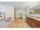 Bright bathroom featuring tiled floors, double sink vanity, soaking tub and separate shower at 105 W Columbus Dr, Tampa, FL 33602
