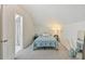 Cozy bedroom with soft carpet and a view to the en suite bathroom at 105 W Columbus Dr, Tampa, FL 33602