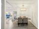 Contemporary dining area adjacent to living room featuring a modern light fixture at 105 W Columbus Dr, Tampa, FL 33602