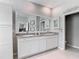 Bright bathroom featuring double sinks, a large mirror, and a neutral color palette at 10978 Laxer Cay Loop, San Antonio, FL 33576