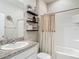 Cozy bathroom with a shower, sink, and plenty of natural light at 10978 Laxer Cay Loop, San Antonio, FL 33576