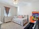 This bedroom has a ceiling fan, beautiful cabinet, bed, and a sofa for a comfortable stay at 10978 Laxer Cay Loop, San Antonio, FL 33576
