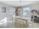Cozy dining room with natural light, comfortable seating, and stylish decor, perfect for Gathering meals at 10978 Laxer Cay Loop, San Antonio, FL 33576