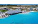 Overhead shot showcases the Mirada Lagoon with blue waters, beach area, bar, and various amenities at 10978 Laxer Cay Loop, San Antonio, FL 33576