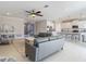 Open living area connects seamlessly to the kitchen, ideal for modern living and entertaining at 10978 Laxer Cay Loop, San Antonio, FL 33576