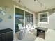 Inviting patio area with stylish decor, seating, and string lights, perfect for relaxing outdoors at 10978 Laxer Cay Loop, San Antonio, FL 33576