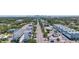 An aerial view showcases a neighborhood with apartments, houses, and downtown in the distance at 11 29Th N St, St Petersburg, FL 33713