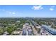 An aerial view showcases a neighborhood with apartments, houses, and downtown in the distance at 11 29Th N St, St Petersburg, FL 33713