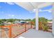A modern balcony features an orange metal railing and views of the neighborhood at 11 29Th N St, St Petersburg, FL 33713