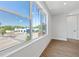 Bedroom with large windows offering city views, complemented by stylish wood-look flooring at 11 29Th N St, St Petersburg, FL 33713