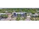 An exterior aerial view of a modern apartment complex surrounded by lush greenery at 11 29Th N St, St Petersburg, FL 33713