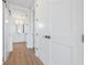 Hallway view showcasing modern doors and a glimpse into a bathroom with a double vanity at 11 29Th N St, St Petersburg, FL 33713