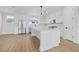Bright, modern kitchen with stainless steel appliances, island and white cabinetry at 11 29Th N St, St Petersburg, FL 33713