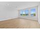 Spacious living area boasts wood-look floors and multiple windows, offering bright, airy living at 11 29Th N St, St Petersburg, FL 33713