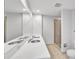 Modern bathroom features dual sinks, a large mirror, and a glass-enclosed shower at 1120 E Kennedy Blvd # 615, Tampa, FL 33602