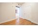 Hallway featuring hardwood floors leading into the kitchen at 1120 E Kennedy Blvd # 615, Tampa, FL 33602