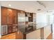Modern kitchen features stainless steel appliances and a large center island with granite countertops at 1120 E Kennedy Blvd # 615, Tampa, FL 33602
