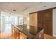 Modern kitchen island with stainless steel appliances, hardwood floors and sliding door at 1120 E Kennedy Blvd # 615, Tampa, FL 33602