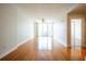 Spacious open-concept living room with polished hardwood floors and large windows at 1120 E Kennedy Blvd # 615, Tampa, FL 33602