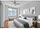 Stylishly furnished bedroom with light gray walls, modern decor, and a large window at 1120 E Kennedy Blvd # 615, Tampa, FL 33602