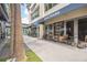 Outdoor patio area with modern tables and chairs, perfect for enjoying coffee or a beer, adding to the community's charm at 1120 E Kennedy Blvd # 615, Tampa, FL 33602