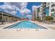 Rooftop pool area with lounge chairs and tables, offering a relaxing outdoor space at 1120 E Kennedy Blvd # 615, Tampa, FL 33602