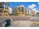 Colorful condo buildings seen from street level showcasing corner building details and nearby business locations at 1120 E Kennedy Blvd # 615, Tampa, FL 33602