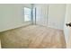 Comfortable carpeted bedroom with window and closet that provides ample space at 11268 Fieldstone Dr, Palmetto, FL 34221