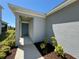 Welcoming front entrance showcasing the covered porch and well-maintained landscaping, providing a warm invitation at 11268 Fieldstone Dr, Palmetto, FL 34221