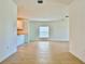Open living room and kitchen area with tile floors and natural light at 11268 Fieldstone Dr, Palmetto, FL 34221