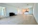 Spacious living room with tile floors, flowing into the kitchen, perfect for entertaining and Gathering gatherings at 11268 Fieldstone Dr, Palmetto, FL 34221