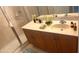 Bathroom with a nice countertop, decorative flowers and a glass shower door at 11468 Captiva Kay Dr, Riverview, FL 33569